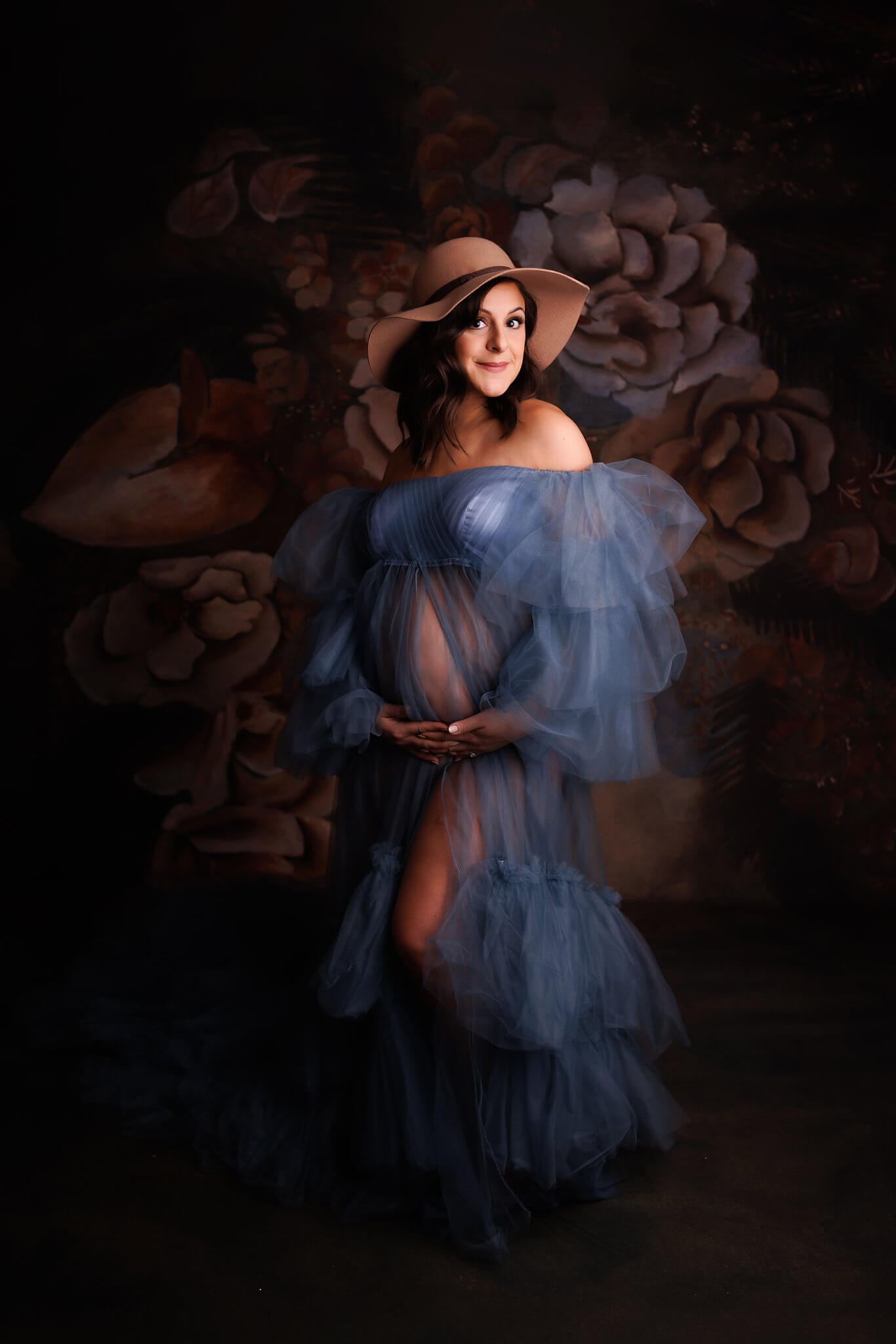 Expectant Mother in a Blue Tulle Gown and trendy hat