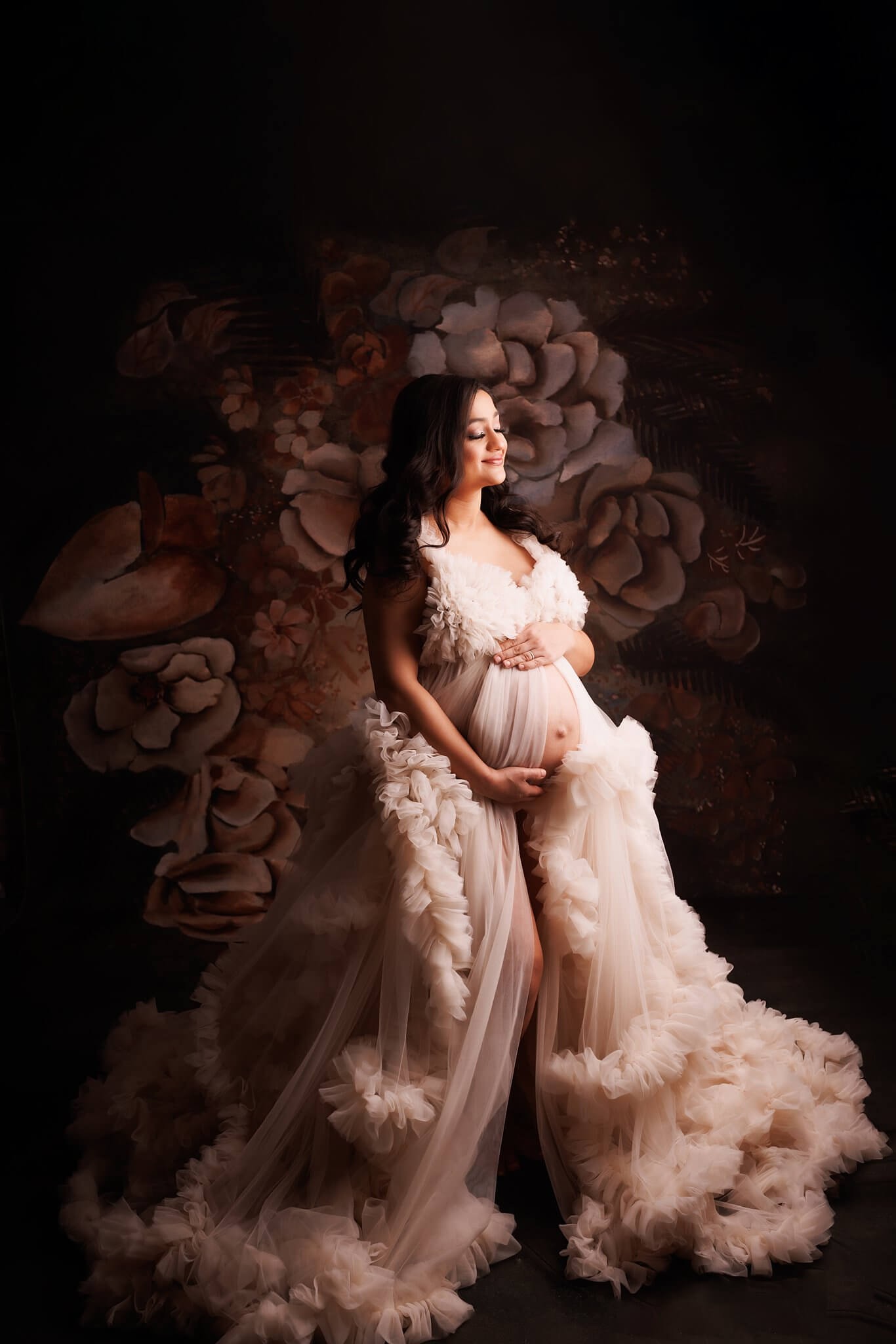 Expectant Mother in a white fluffy maternity dress