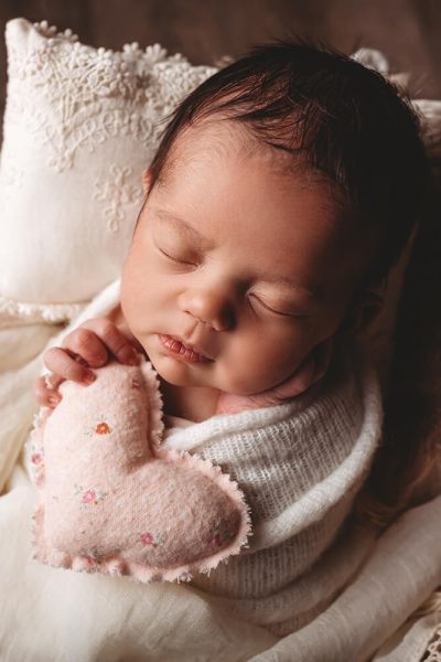 Photo of a baby in a wicker basket,