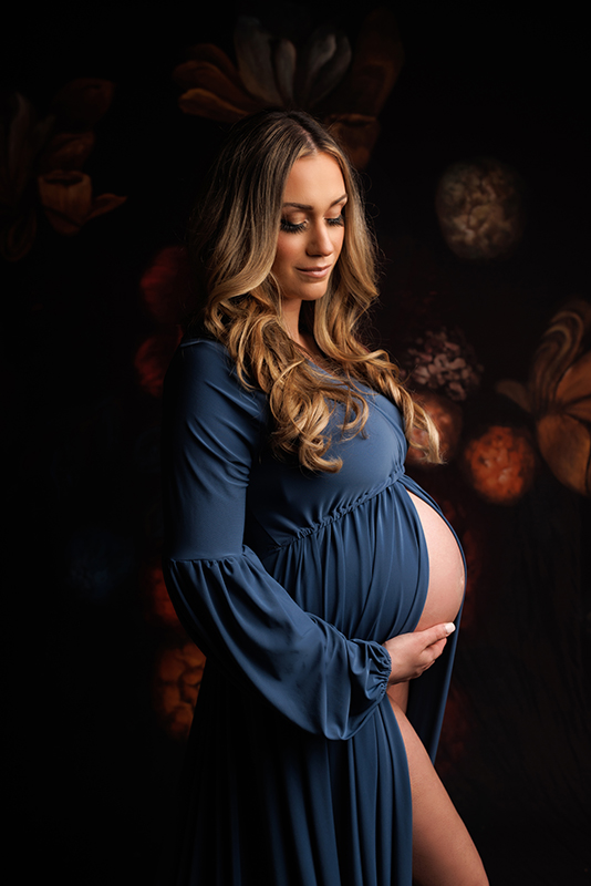 Maternity Photography Greater Toronto Area Mother to be in a blue dress looking away from the camera