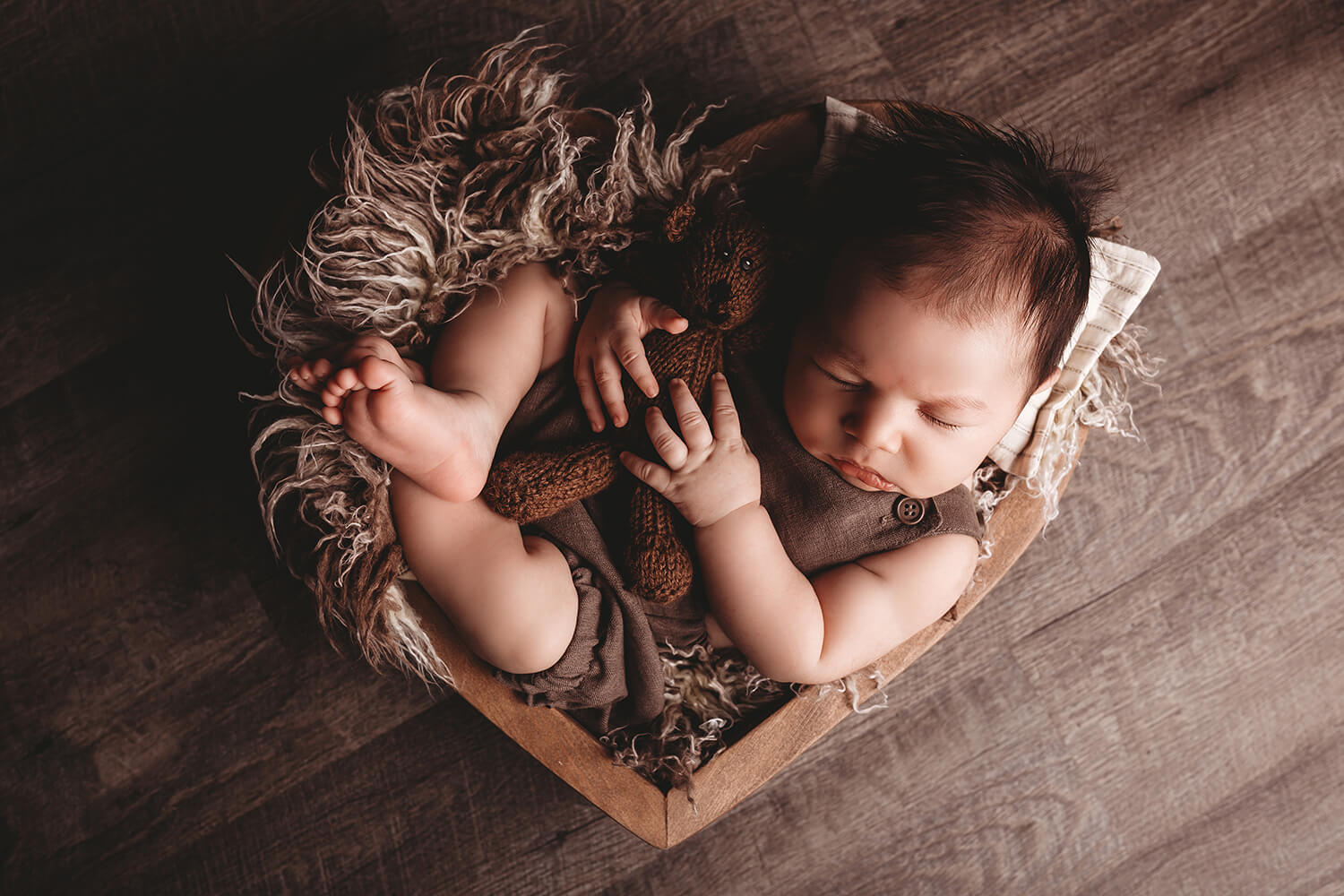 Photo of baby in wooden box Lactation Consultant Ontario